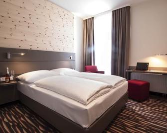 Amaro Hotel - Bergkirchen - Schlafzimmer
