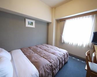 Hotel Route-Inn Yukuhashi - Kitakyūshū - Schlafzimmer