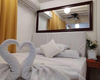 Makati Riverside Inn - Makati - Schlafzimmer