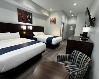 Travelodge by Wyndham Cochrane - Cochrane - Schlafzimmer