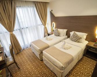 Lamar Ajyad Hotel - Mekka - Schlafzimmer
