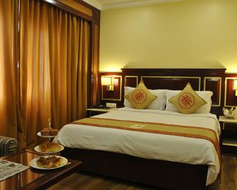 Hotel Dynasty - Gauhati - Schlafzimmer