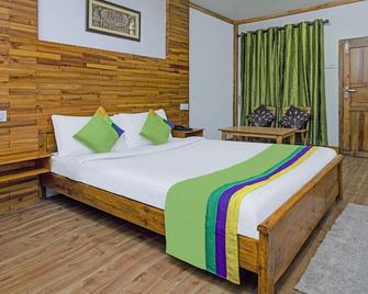Treebo Omega Stay Inn - Шиллонг - Спальня