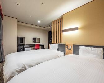 Kagoshima Plaza Hotel Tenmonkan - Kagoshima - Bedroom