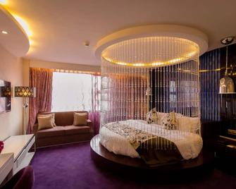 Fuzhou Fliport Garden Hotel - Fuzhou - Slaapkamer