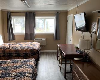Village Inn & Suites - Sudbury - Schlafzimmer