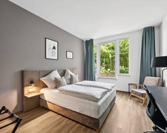 Home and CoLiving Bonn I Aparthotel - Bonn - Schlafzimmer